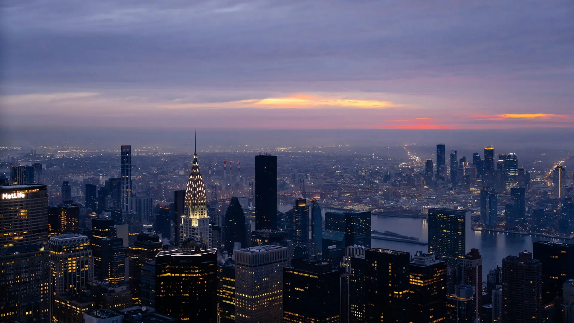 New York City skyline at night with illuminated skyscrapers